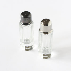 Cut crystal salt and pepper shakers with silverplated caps