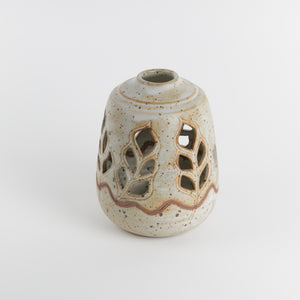 Japanese stoneware lantern with leaf cutouts, rust speckled glaze