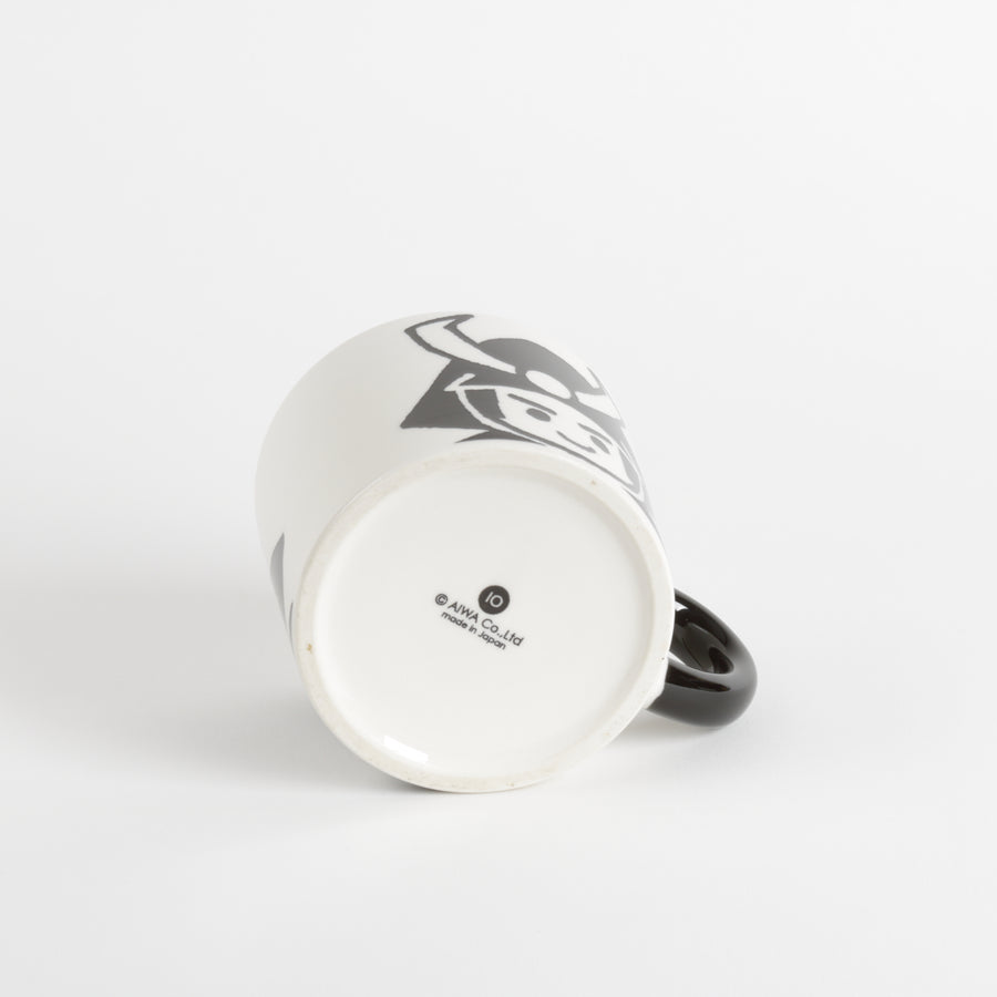 White coffee mug with black handle and warrior graphic face