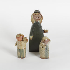 Three ceramic figures on a white background
