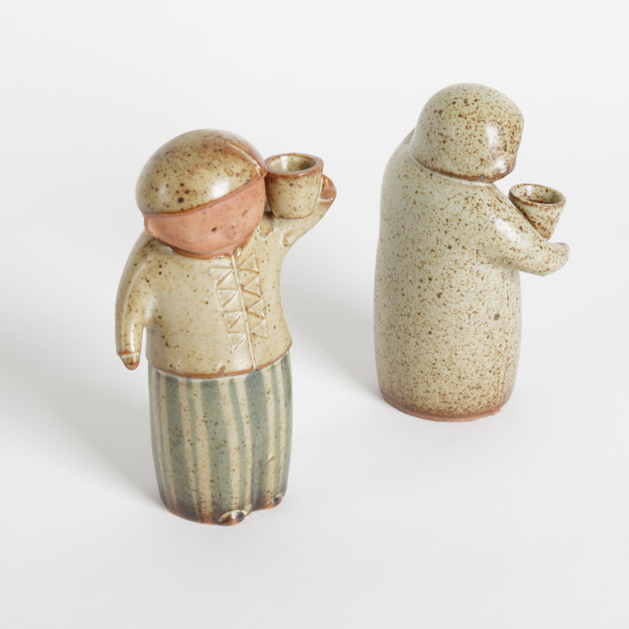 Three ceramic figures on a white background
