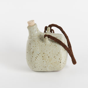 Studio pottery handing flask with cork and braided suede strap