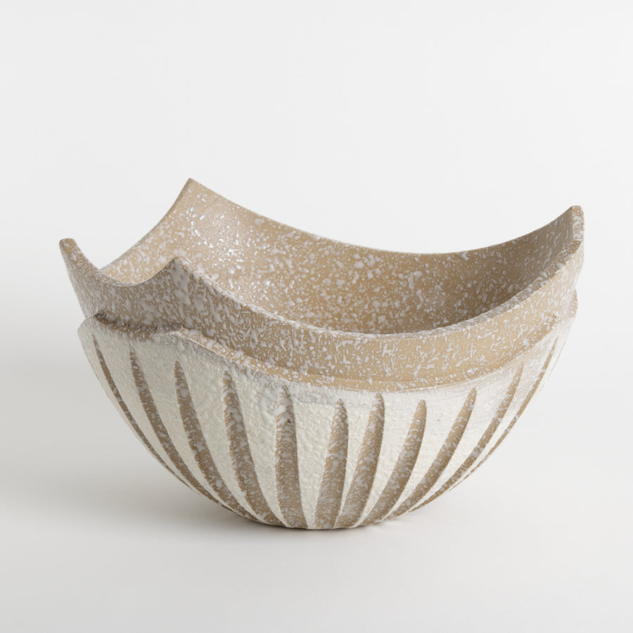 Ceramic bowl with textured surface on a white background