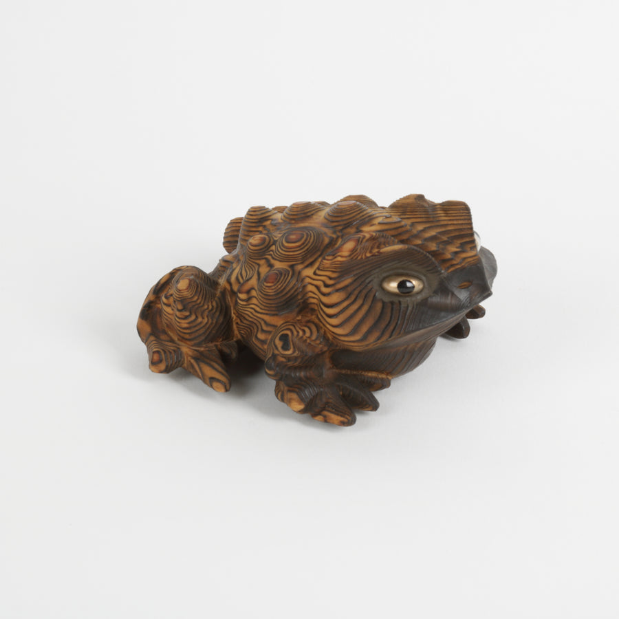 Carved Japanese toad with gold eyes