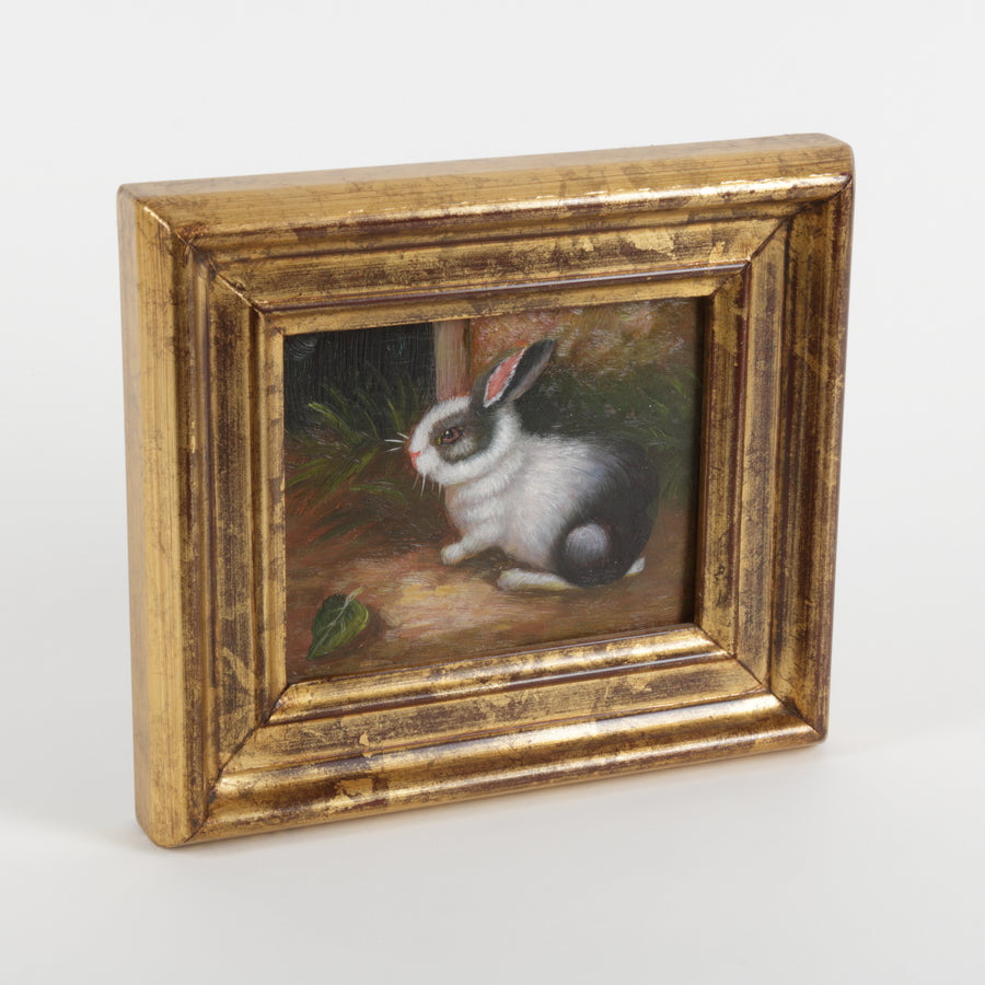 Small oil painting of a rabbit in a wooden frame on a white background