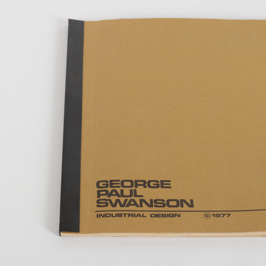 Brown soft bound book with black text and logo on a white background