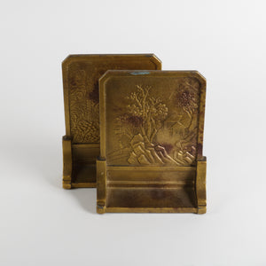 Two Gilt bronze bookends with embossed designs, Japanese garden