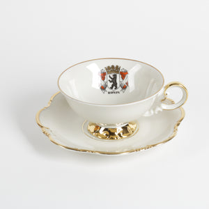 Teacup and saucer with a Berlin coat of arms design, white with real gold base and rim
