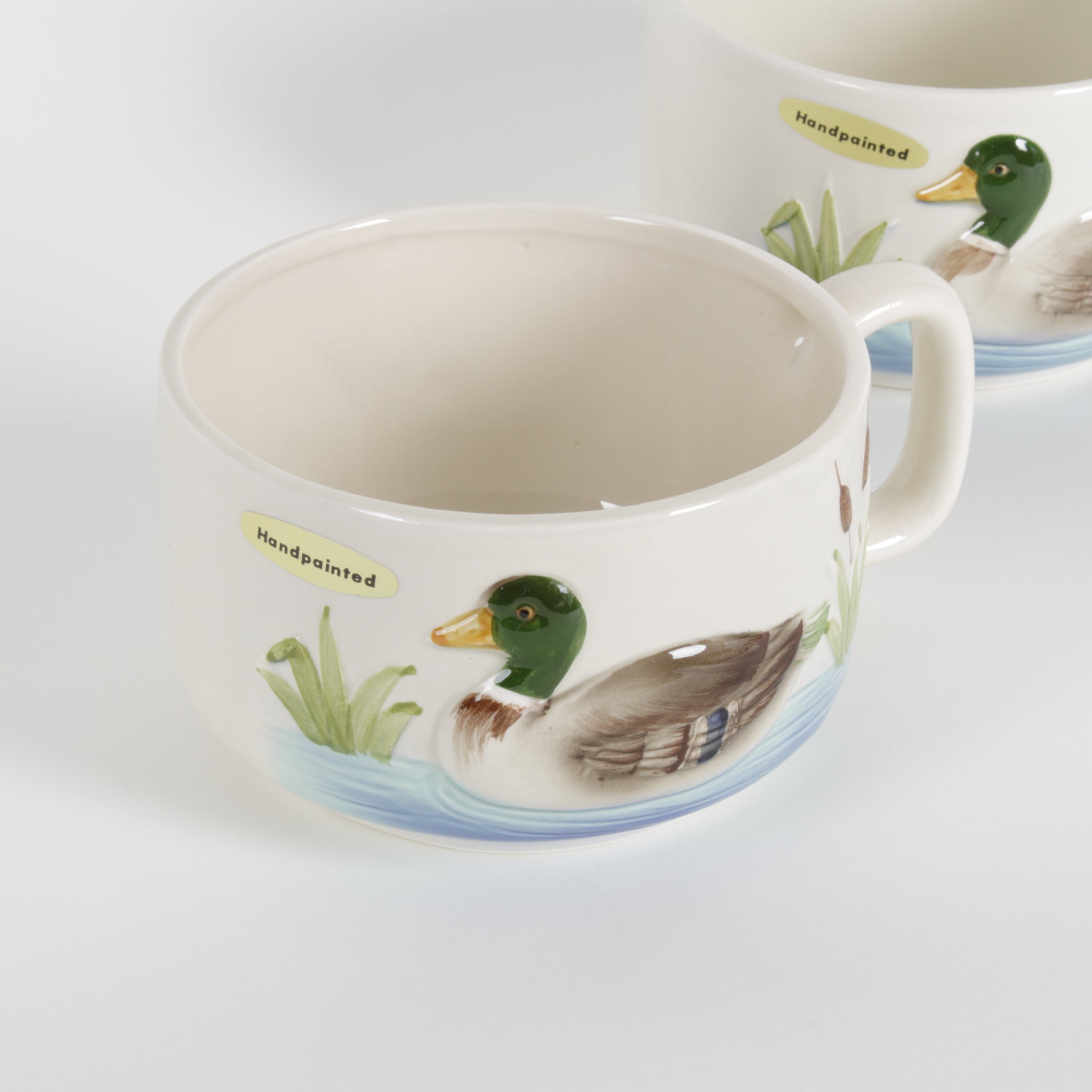 two ceramic white mugs with hand painted mallard duck