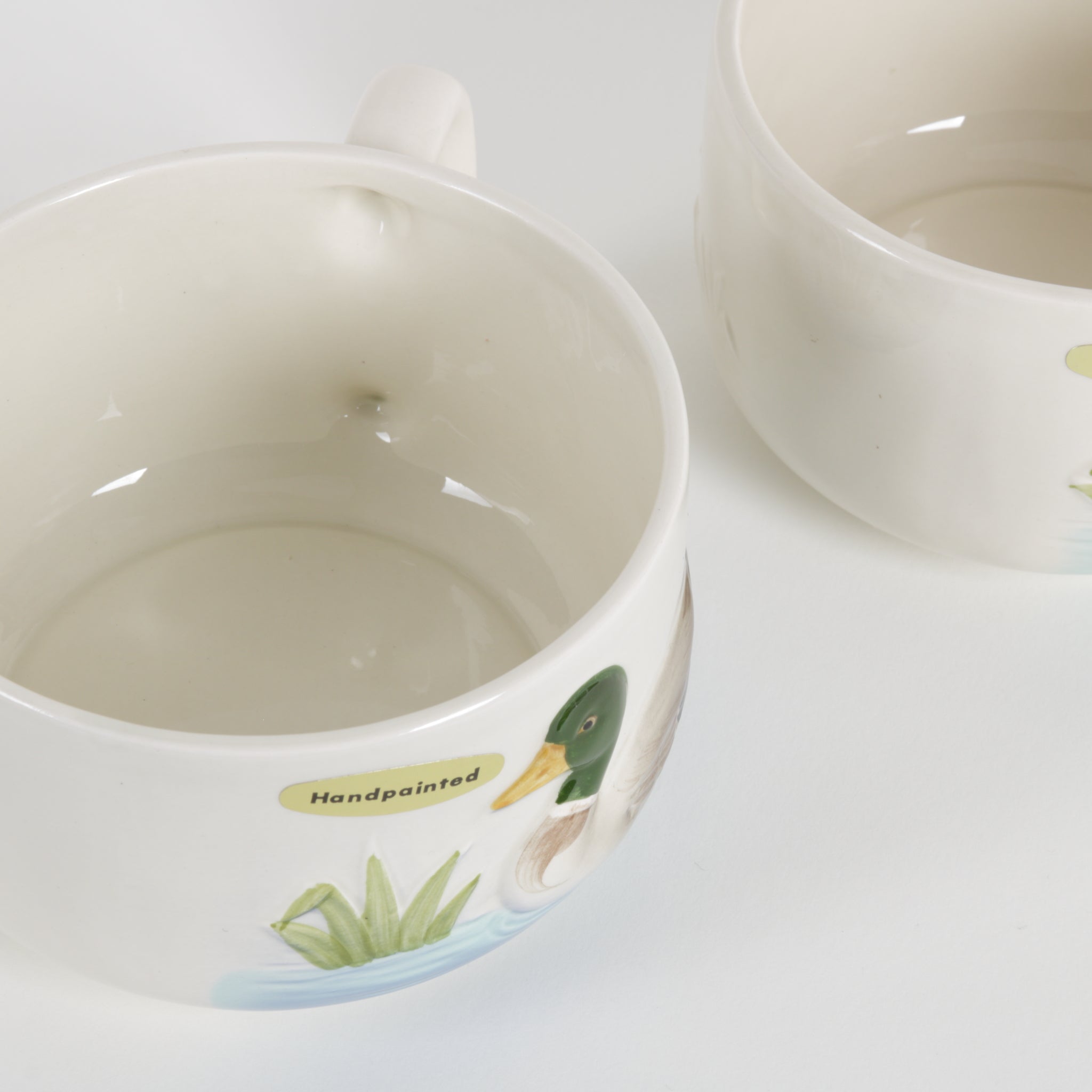 ceramic poured duck motif mugs