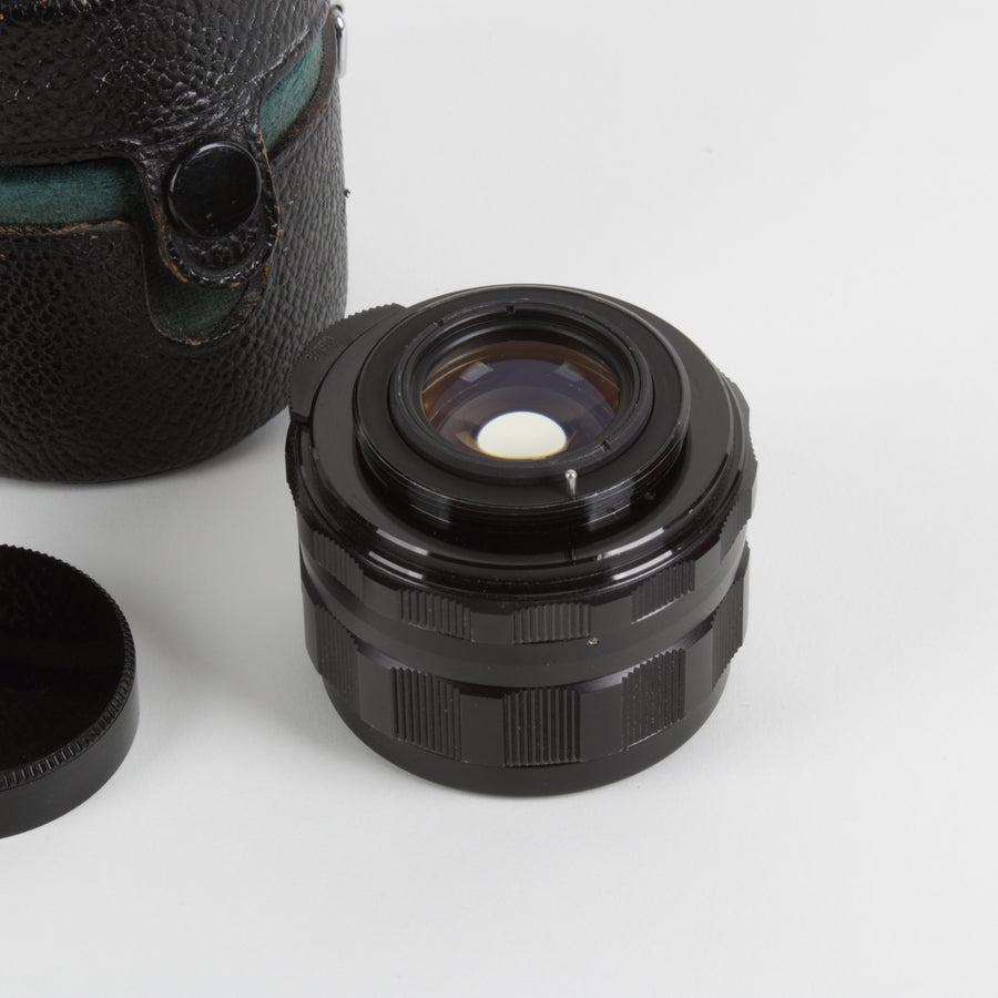 Black 55mm camera lens with Honeywell Pentax branded cap and leather case