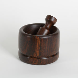 Wooden mortar and pestle on a white background