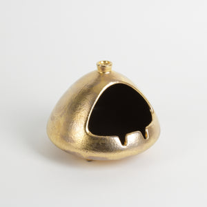 gold glazed ashtray with opening and chimney for smoke vent