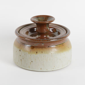 Studio pottery lidded jar, stoneware with rust and putty colored glaze