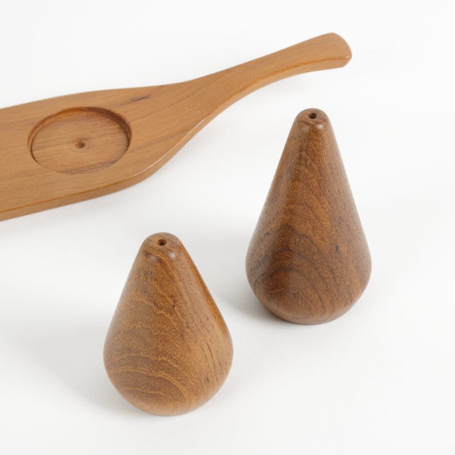 Cone shaped teak salt and pepper shaker set on tray