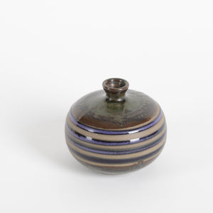 small ceramic vase with olive, amber and cobalt blue stripes over raw fired clay