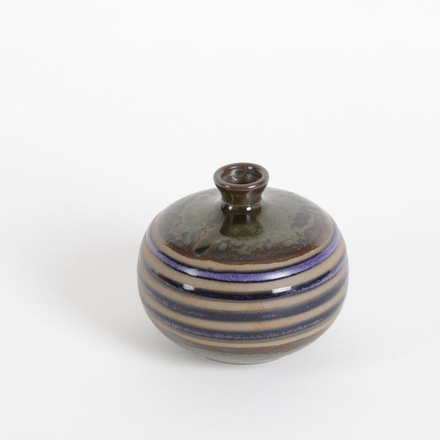 small ceramic vase with olive, amber and cobalt blue stripes over raw fired clay