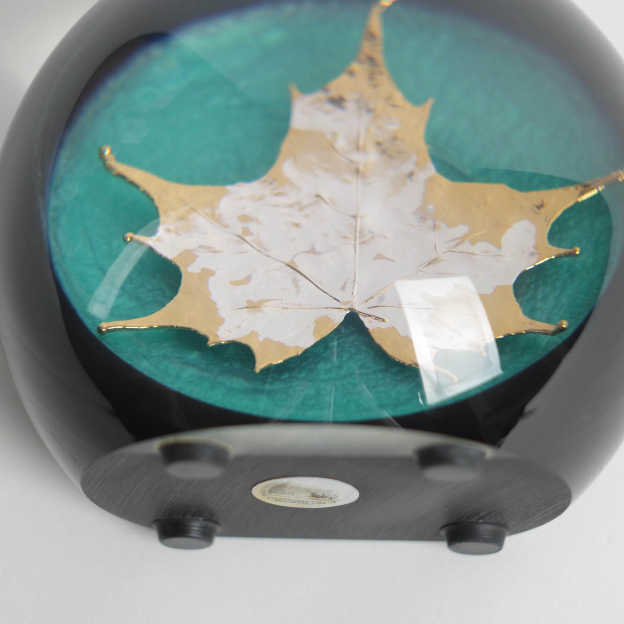 Bottom of maple leaf acrylic paperweight