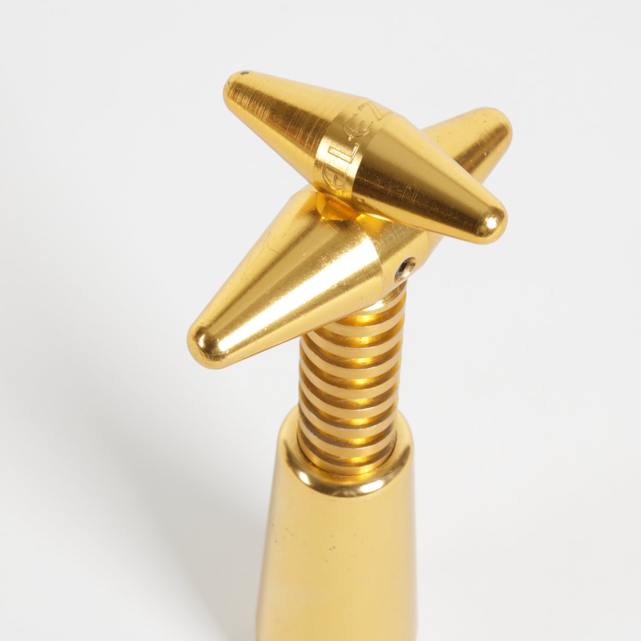 Gold-colored wine bottle opener corscrew