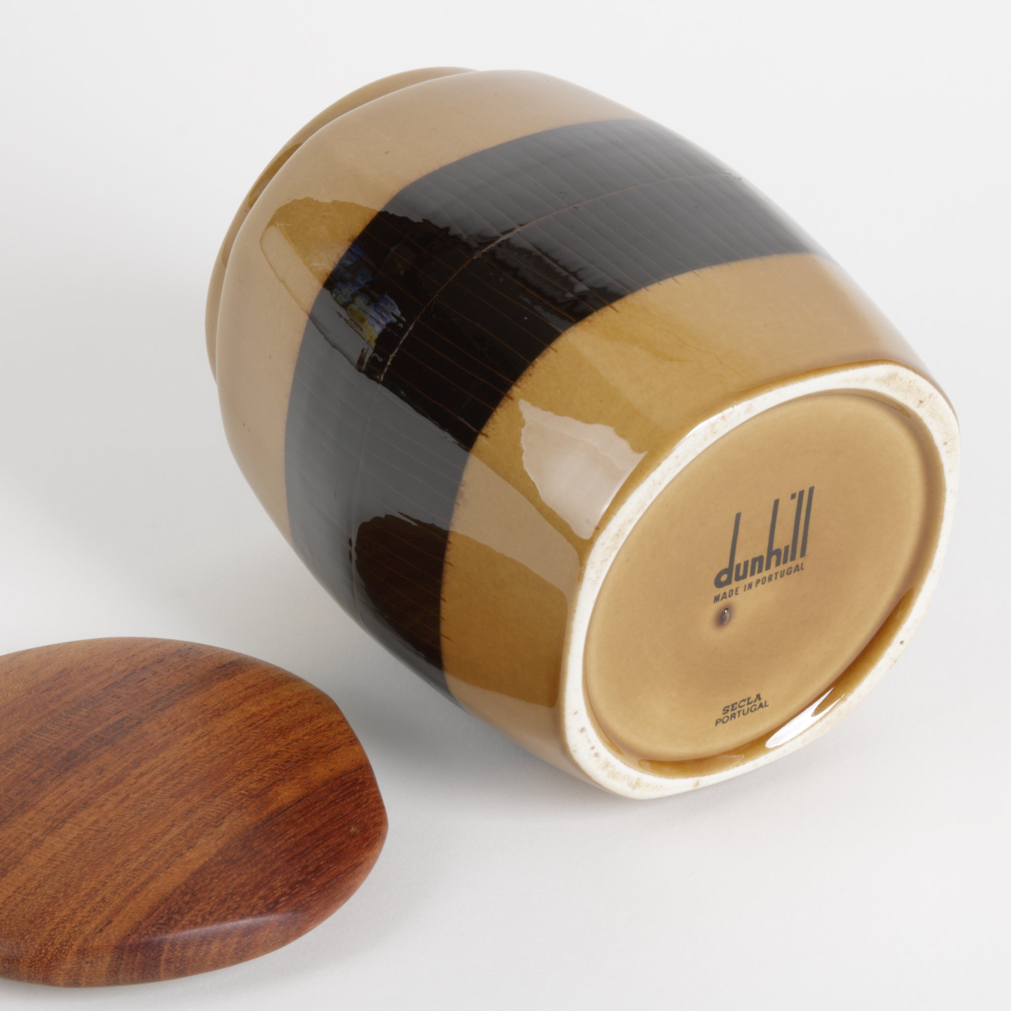 Cylindrical wooden container with a lid on a white background, featuring the Dunhill brand.