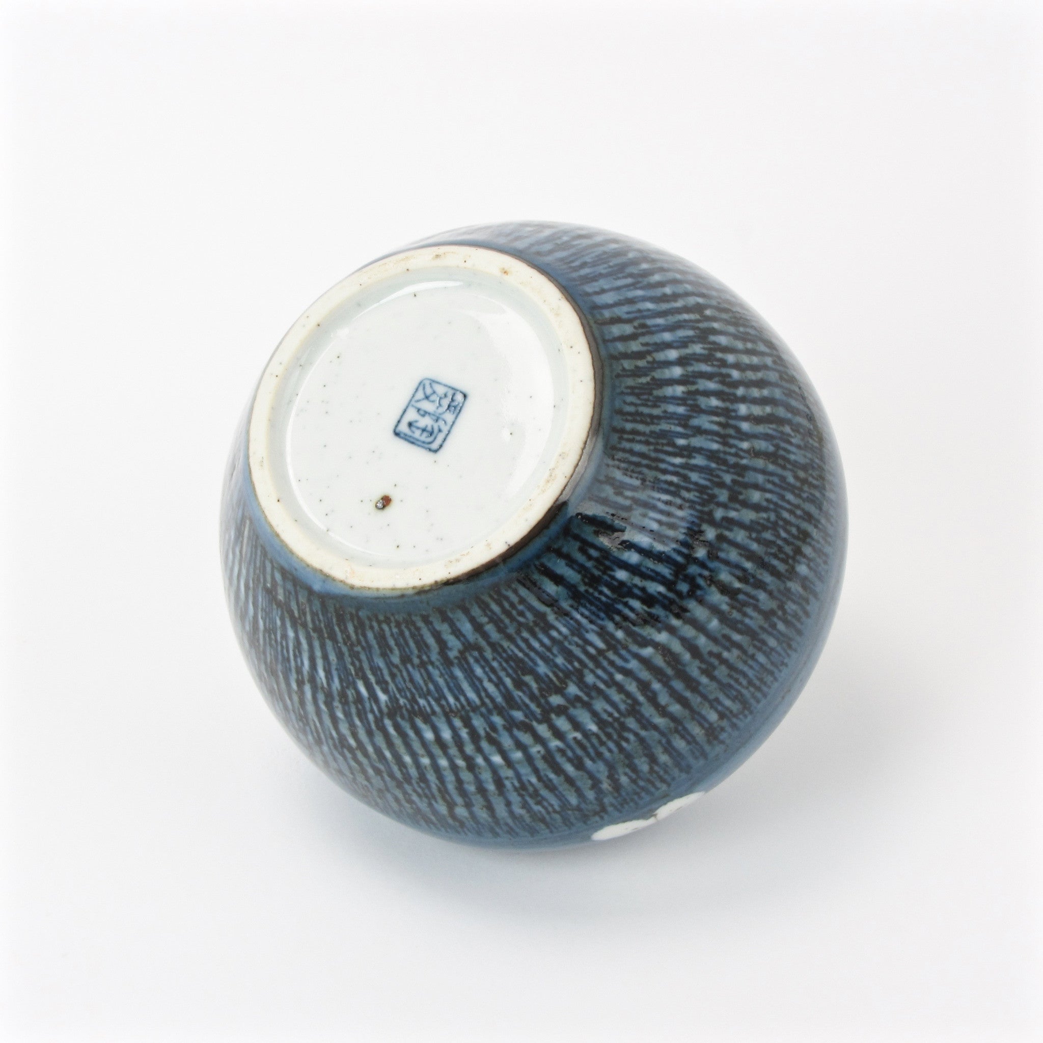 Blue Otagiri vase with floral design signature at bottom