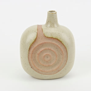 Sculpted Japanese sake vase with speckled cream glaze over blush