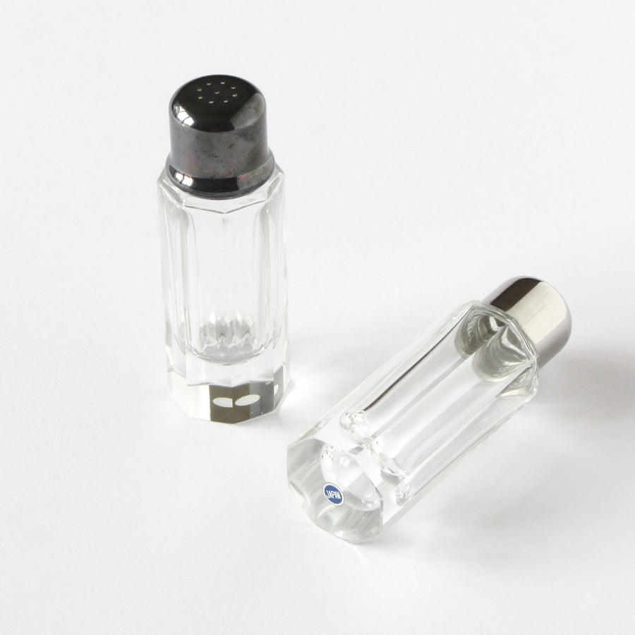 Cut crystal salt and pepper shakers with silverplated caps