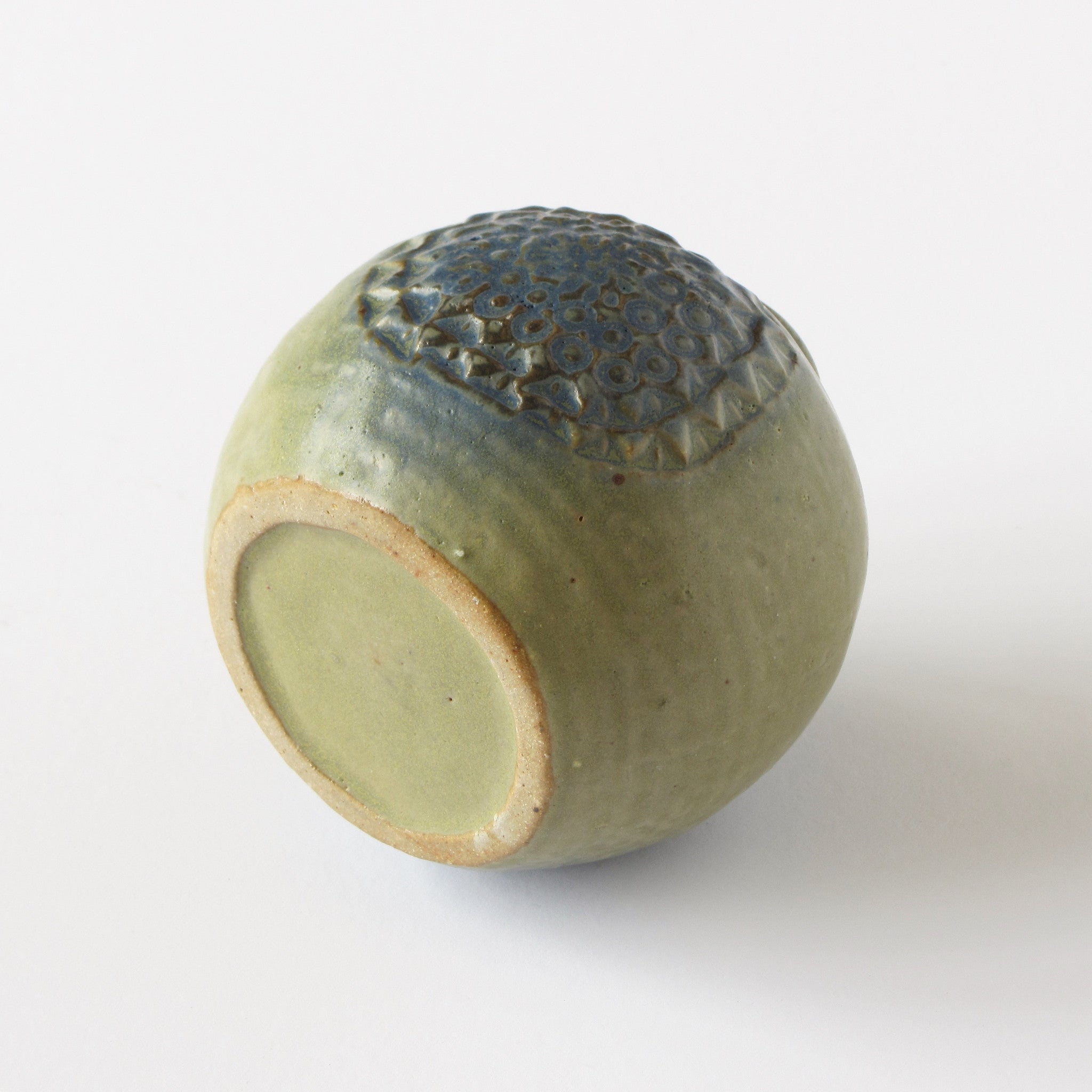 Danish modern bud vase in green with blue floral impression bottom view