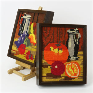 Framed needlepoint art canvases with still life fruit
