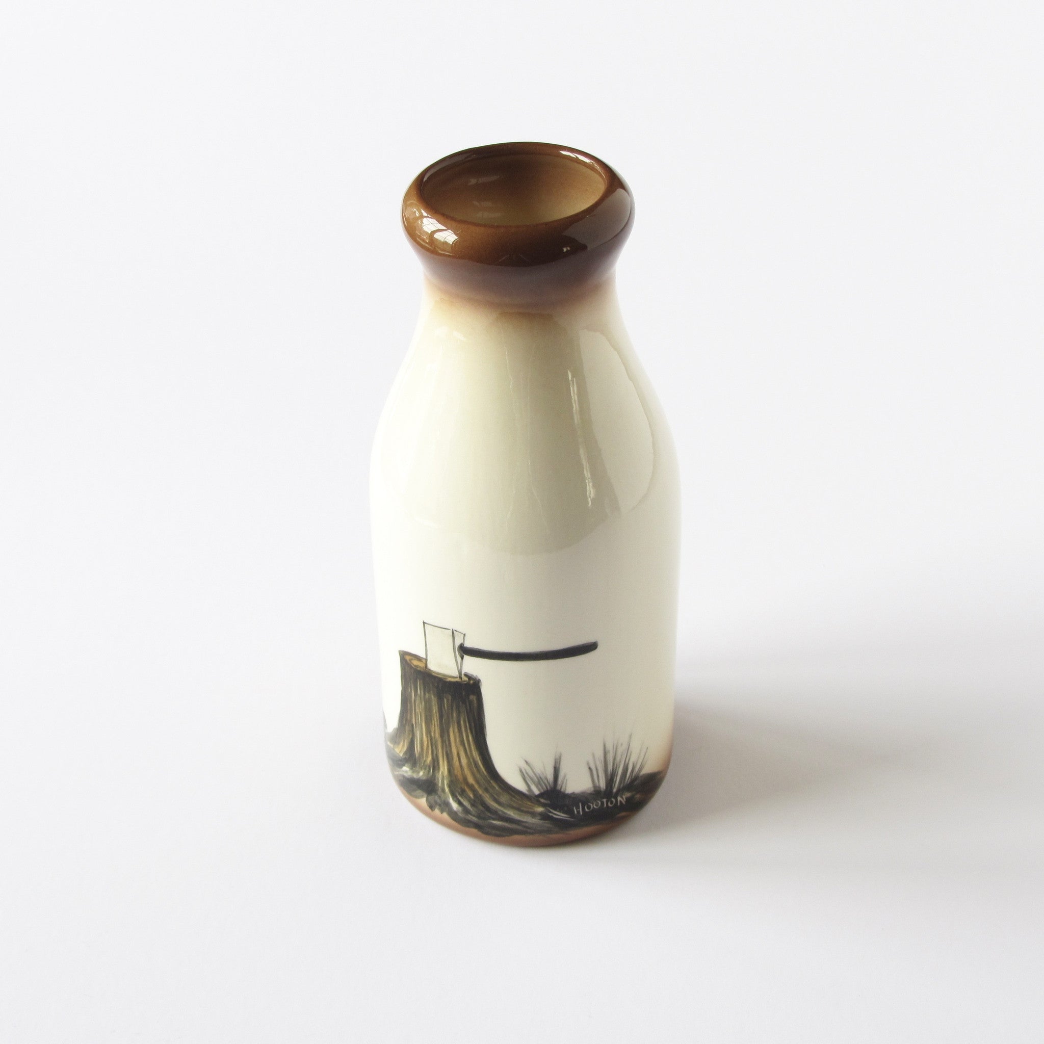 Hand painted and signed Hooton ceramic Milk Jug with axe and log design