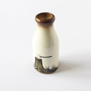 Hand painted and signed Hooton ceramic Milk Jug with axe and log design