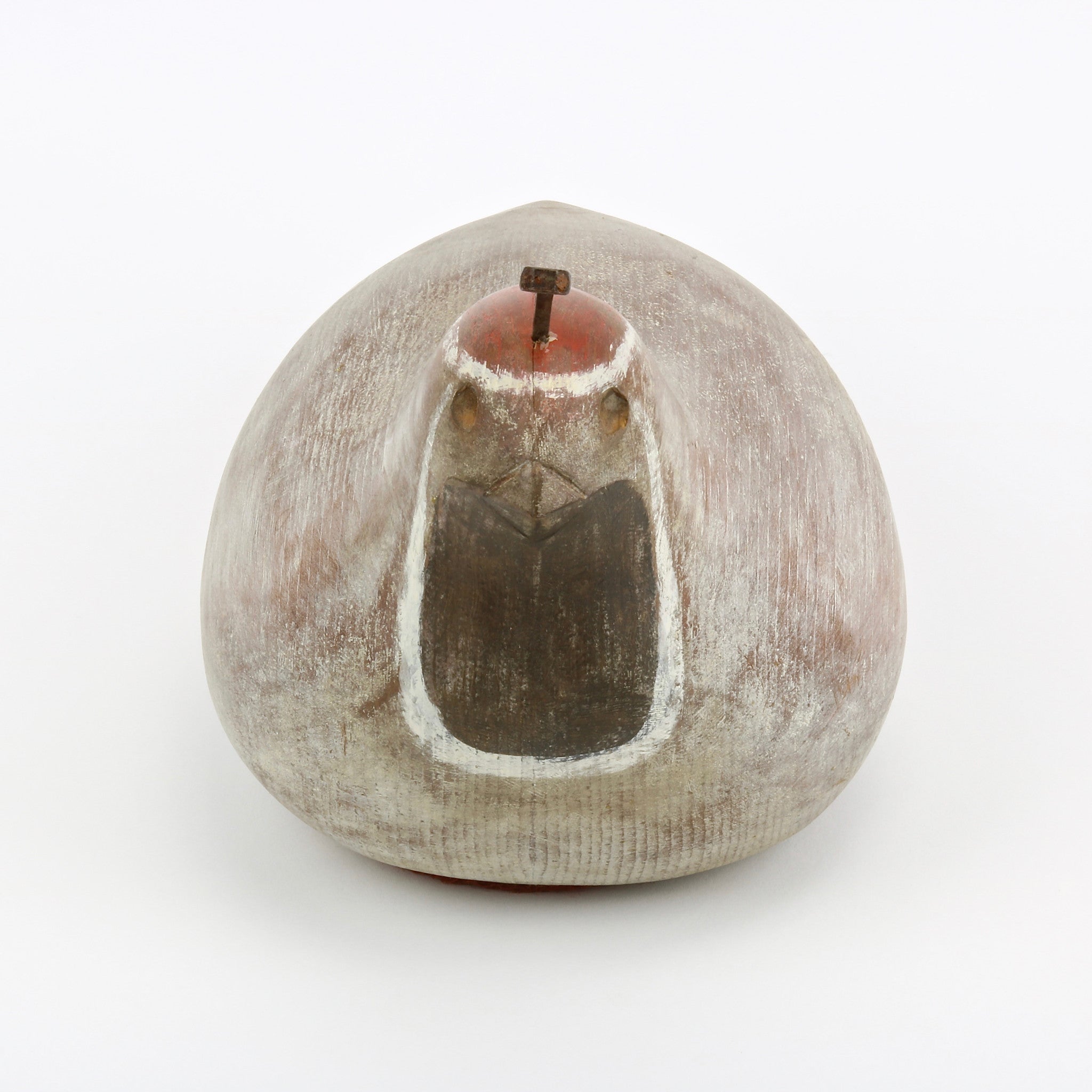 Hand carved wood quail sculpture with nail feather and felt base front view