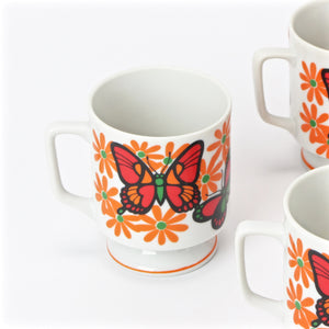 Japanese tea cups with butterfly floral design detailed view