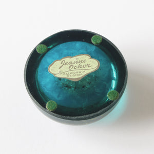 Blue acrylic Jeanne Ocker paperweight original sticker logo