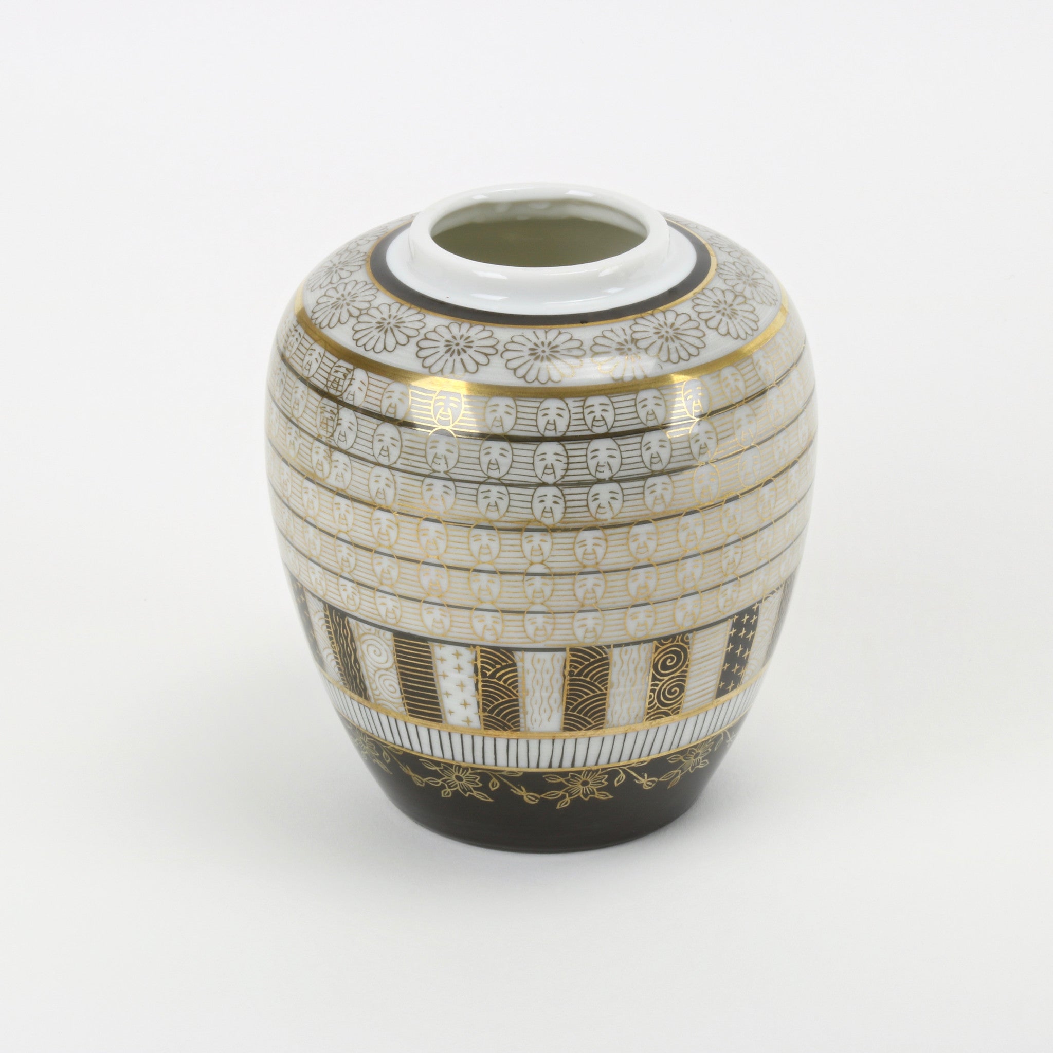 Toyo hand painted vase with gold faces and flower decorations