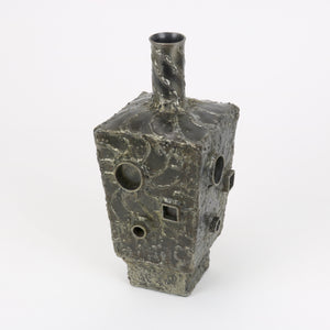 Brutalist steel vase side detail circles and squares
