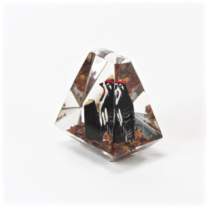 Acrylic woodpecker paperweight side view